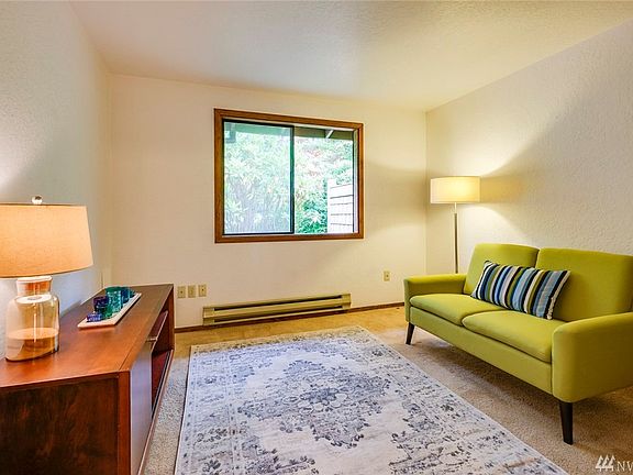 Here is the bedroom on the main level. It has nice light and a view of the mature trees.