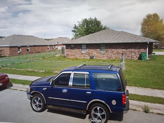 View of side and back fenced yard.