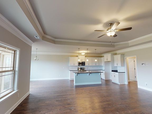 Kitchen and Living Area With Ceiling Fan