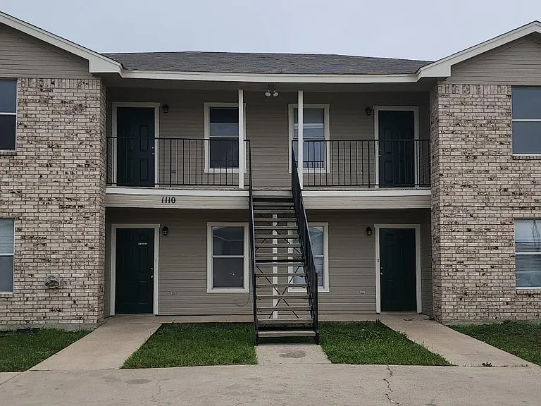 Exterior has been repainted with contemporary color scheme and reserved parking for two cars/unit.