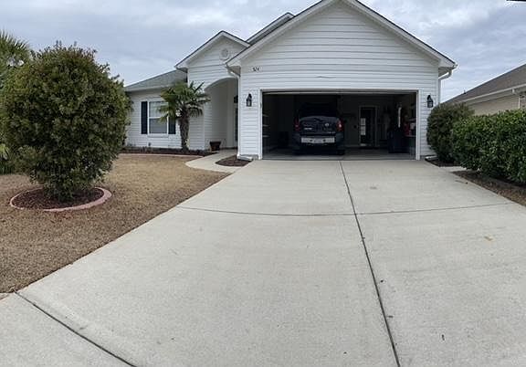 View of driveway and garage