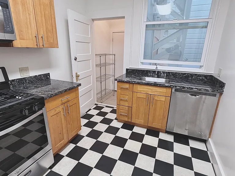 Kitchen view with open porch/pantry door