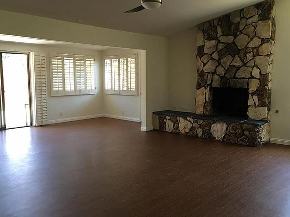Extra-large living room has a "sun room" attached to it.