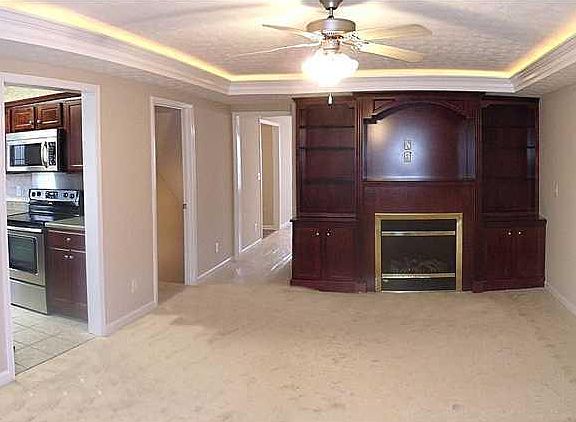This color carpet througthout, built in entertainment center.