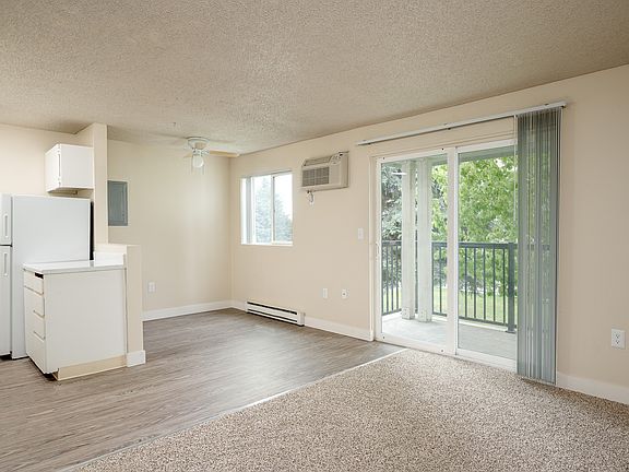 Sunset Apartments | Living Area + Balcony