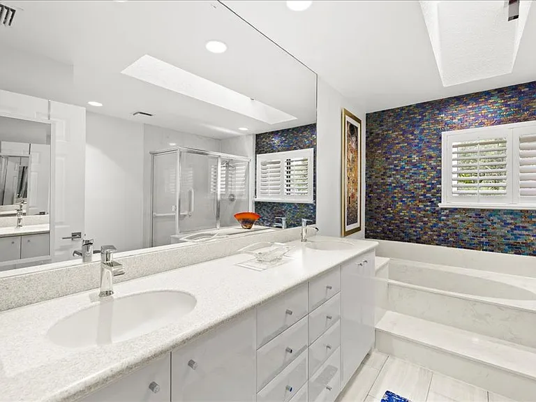 Master bath with roman tub and separate shower area.