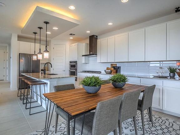 The openness from the kitchen and cafe allow for seamless transitions from room to room while entert