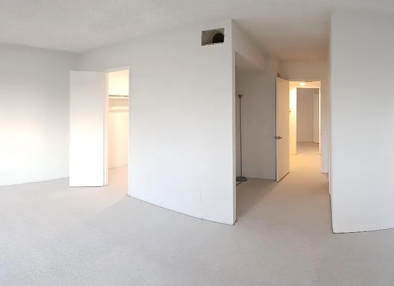 Master bedroom with walk-in closet and private bathroom.