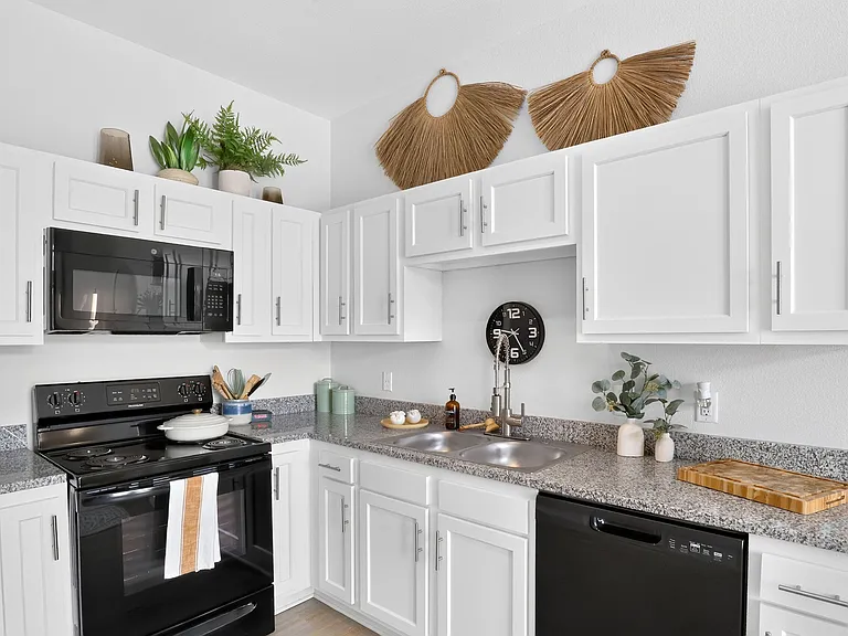 Cook and Entertain in a Modern Kitchen with Granite Countertops at Ralston Apartments