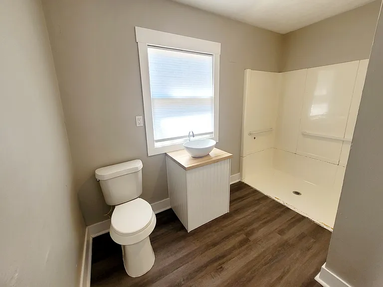 Main floor bedroom ensuite with walk in shower