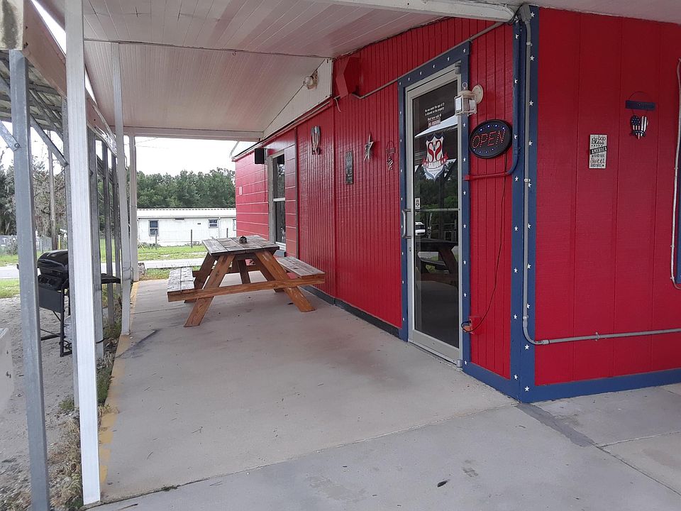 Large L Shaped Covered patio area for plenty of outdoor seating http://BuyThisBar.com