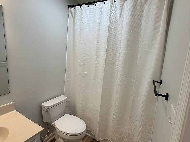 Secondary Bathroom with brand new toilet (enter from Hallway)