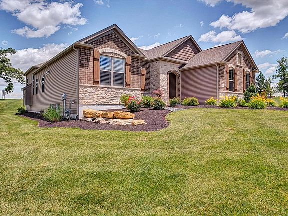 Premium Exterior Elevation with Brick and Stone, Holiday Light Package, Irrigation System, Professional Landscape package, Large lot, Side Entry Garage, Covered Porch...Absolutely beautiful