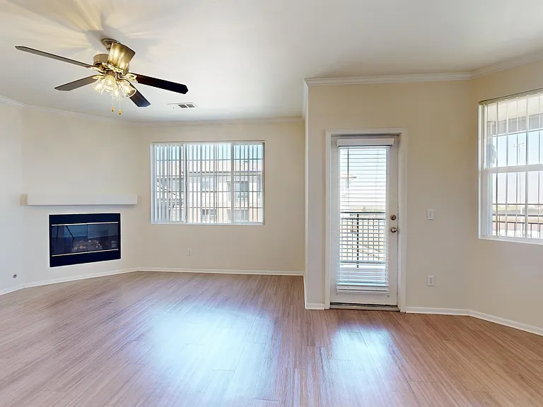 Apartment living room with wood-style flooring.