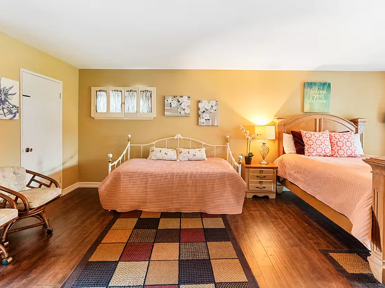 This is the huge owner suite. It also has a walk in closet on the left side. As can be seen in the picture it can accommodate a bed (the picture has a queen bed) plus a day bed.