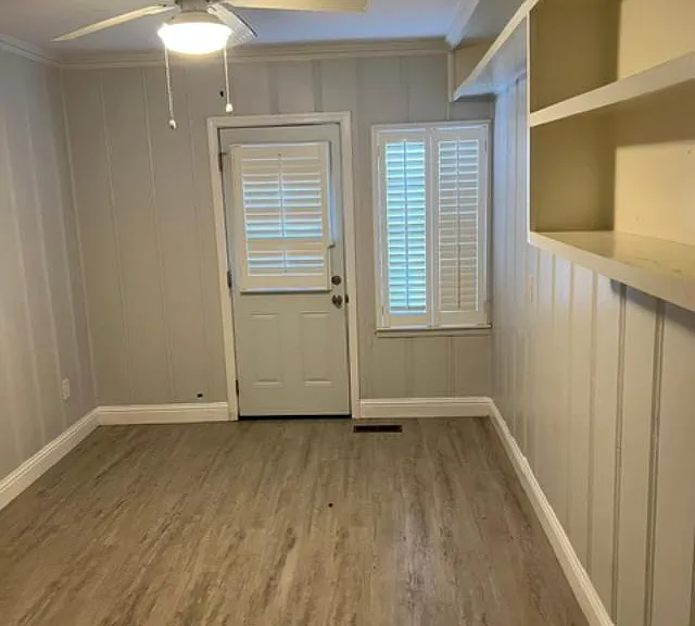 Room 3. Private entrance. Great room for gathering, watching TV, studying or bedroom. Built in shelves and cupboards for storage.