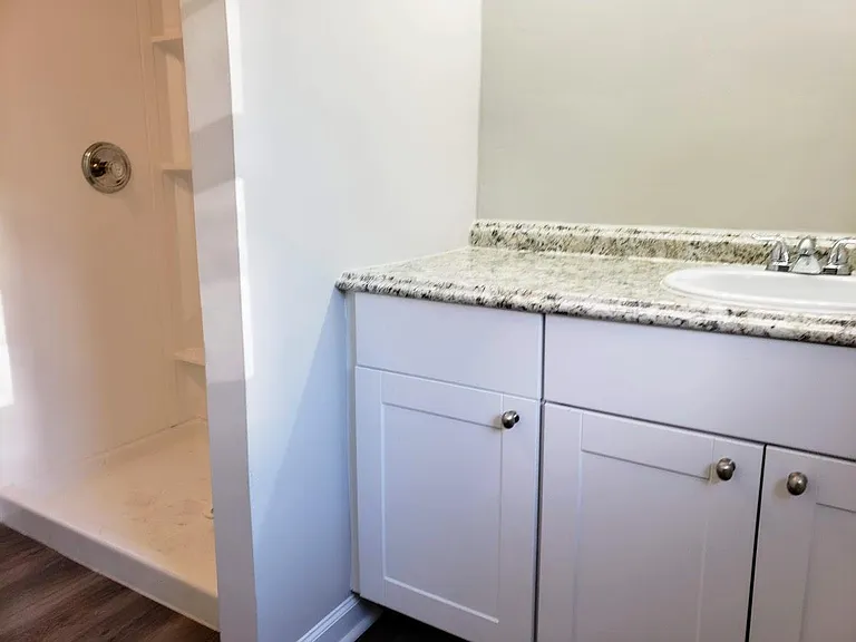 Fully updated bathroom with walk in shower and granite countertops.