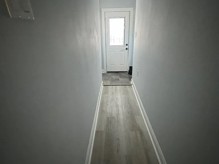 HALL TO TWO BEDROOMS AND BATHROOMS