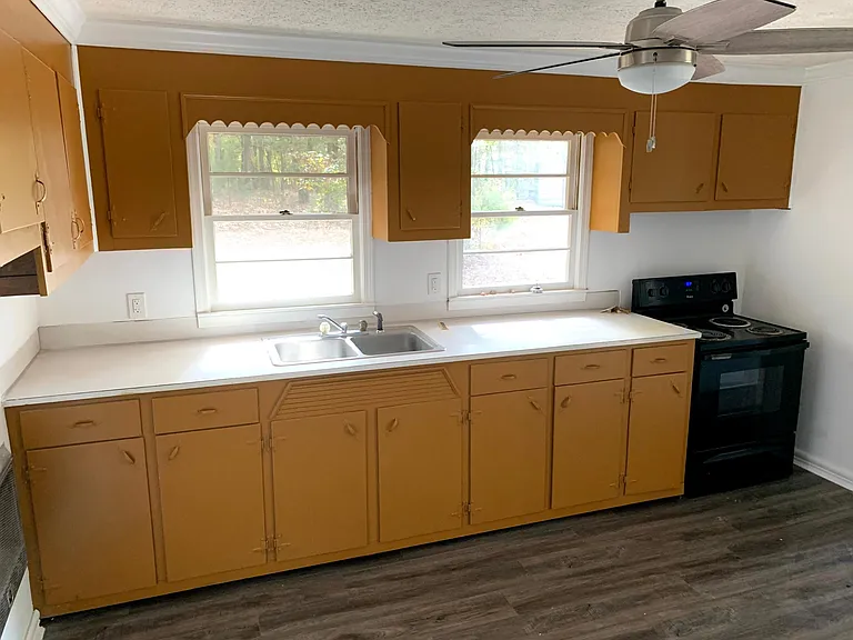 Original wooden cabinetry with a lot of storage space