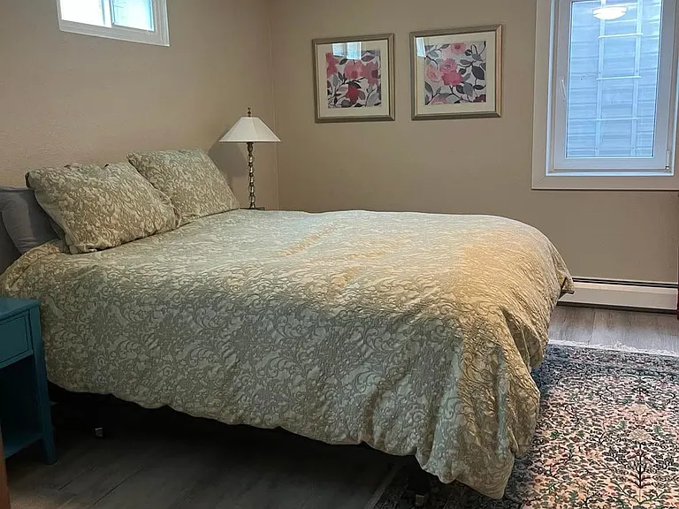large bedroom with closets and lots of natural light