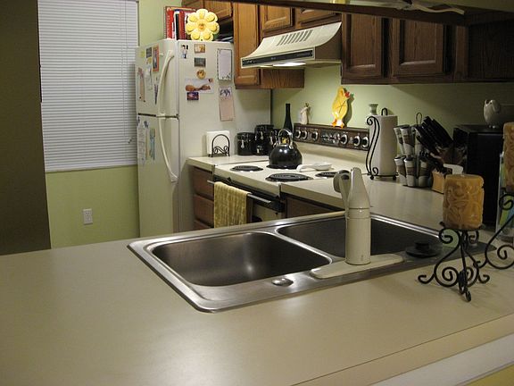Efficient kitchen with oak cabinets