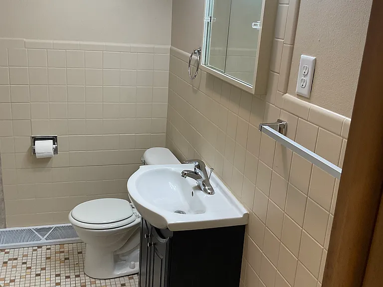 Freshly painted bathroom with newer vanity