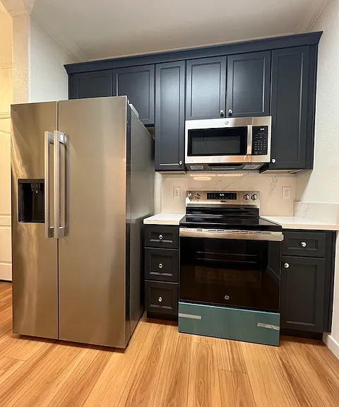 Brand NEW Refrigerator, Induction countertop and stove Plus microwave with lots of storage. Gorgeous countertops and new flooring too.