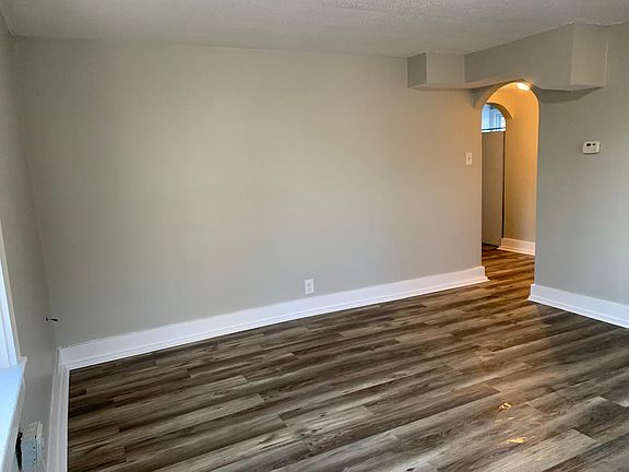 Living room, with four windows. Lots of natural light!