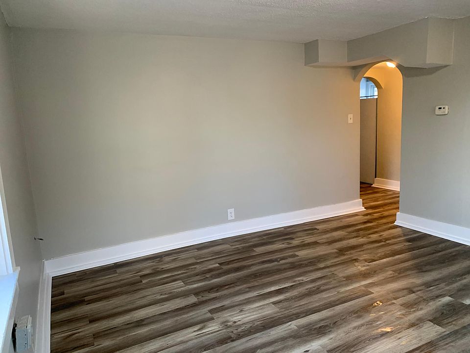 Living room, with four windows. Lots of natural light!