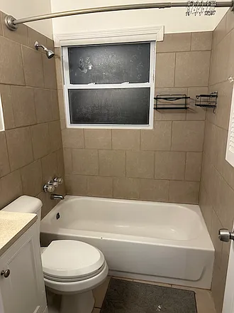 The bathroom is completely tiled and has new automatic exhaust fan.