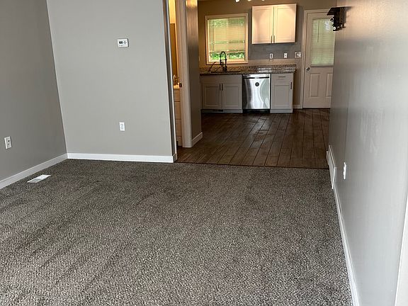Living room looking into kitchen