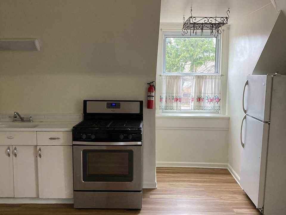 Beautiful eat-in-kitchen with pantry, appliances and microwave.