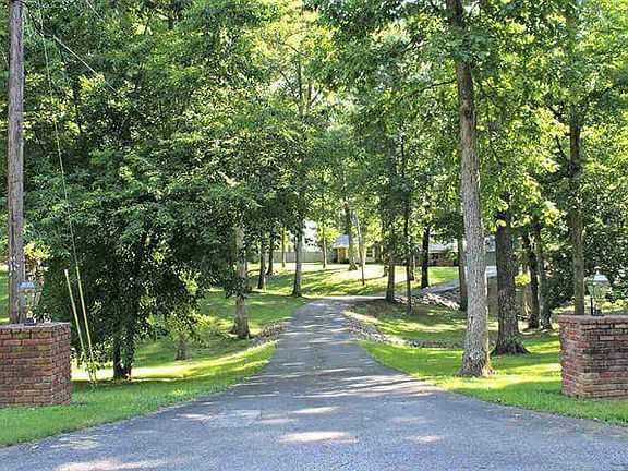 Paved drive/Lit Brick Posts