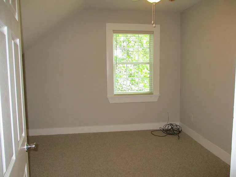 Upstairs bedroom with carpet