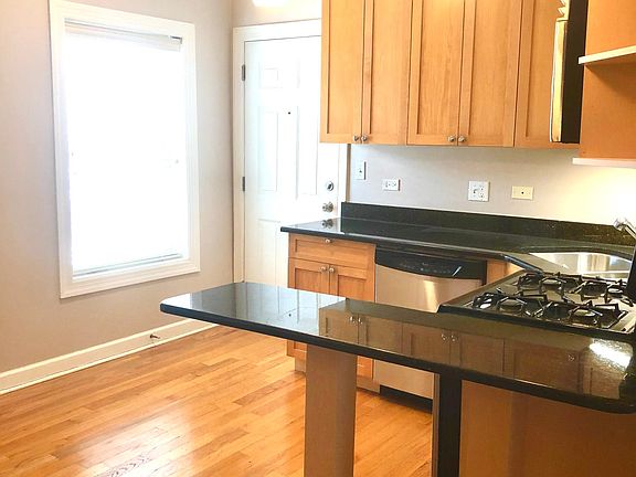 Fully-equipped kitchen. Stainless refrigerator, stove, microwave, and dishwasher. We_ll-positioned new task lighting. __