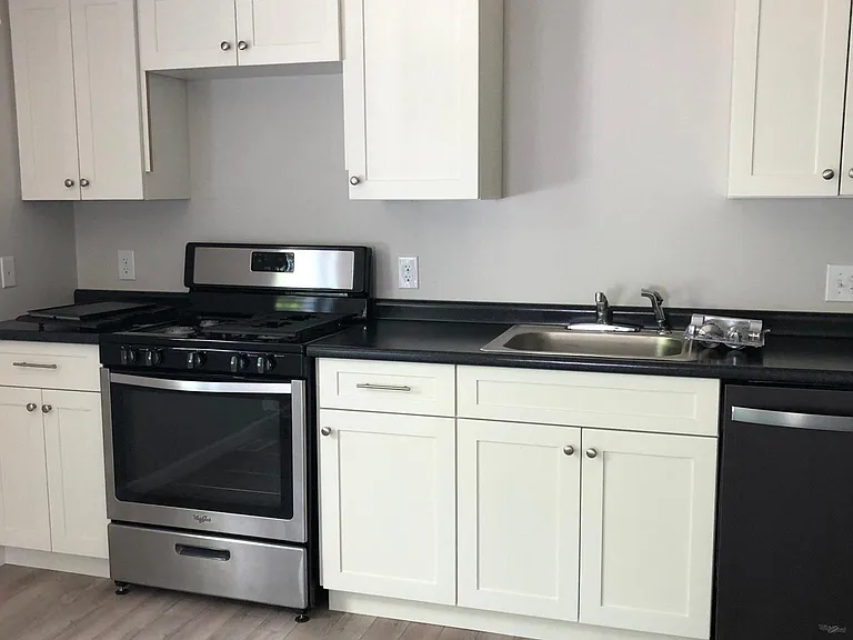 White cabinets!! Black counters and stainless appliances
