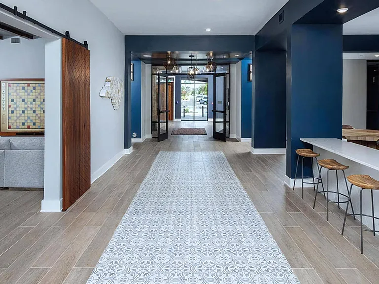 Spacious Common Area with Library Nook, Bistro Stools, and Game Room Access