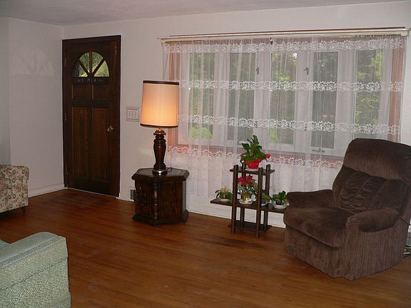 Formal living room with bay window and hw floors