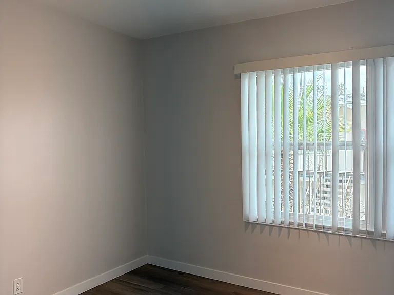 Bedroom with walk0in closet featuring plenty of storage