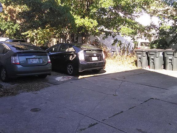 Parking in rear, four cars total, one per unit