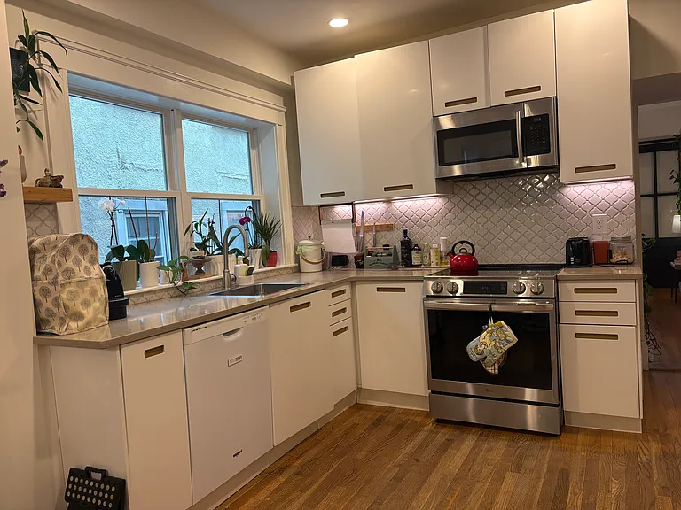 Kitchen from another unit in the building that is very similar to the new kitchen that is being installed in this unit.