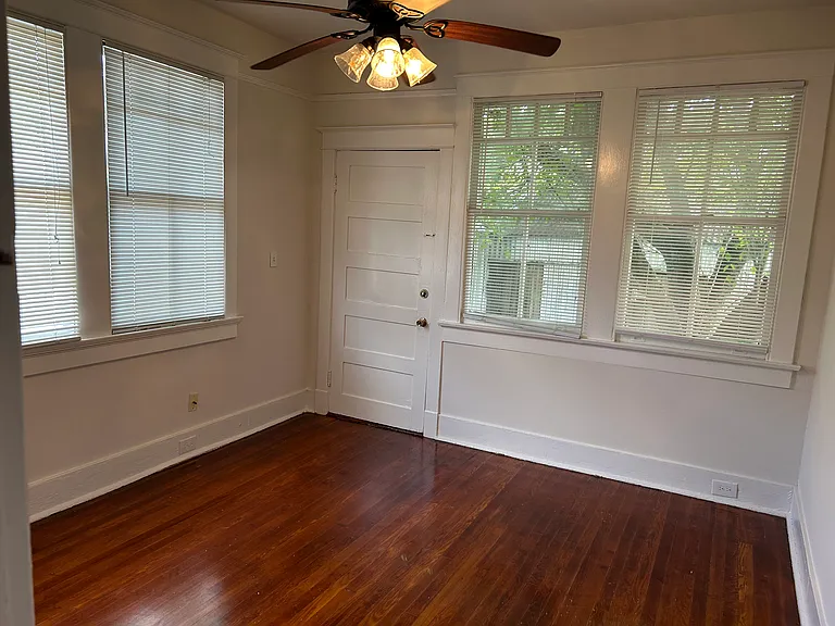 Rear bedroom with door to small yard
and to laundry shed.
