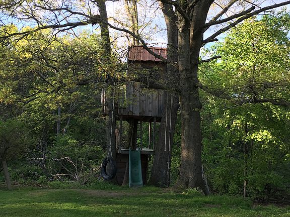 Treehouse includes rock wall