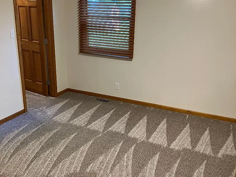 spare bedroom with full walk in closet