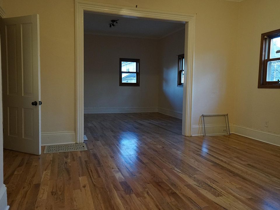 Large dining room looking to living room Just installed All new Solid Oak FlooringThroughout entire Appartment no Luxury cheep flooring here