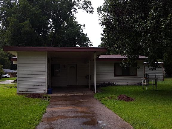 Carport, Utility Room on left, Utility Shed and fenced-in ba