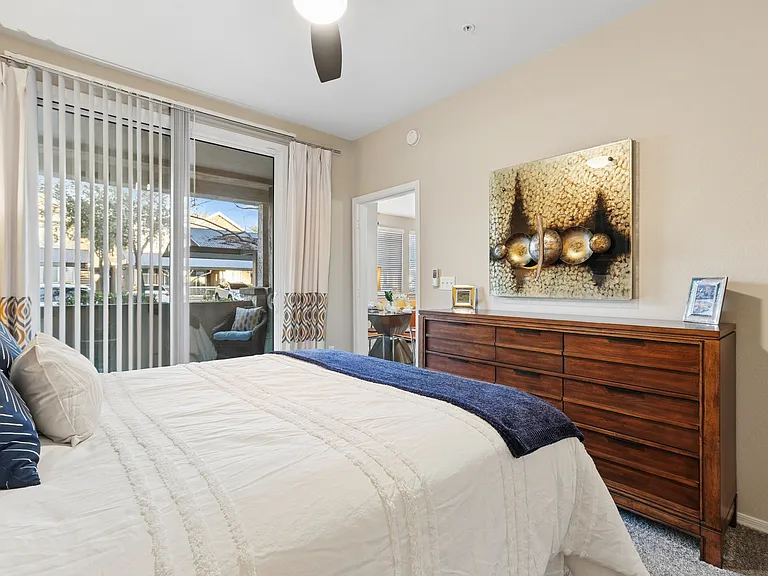 Welcome to Highland Groves at Morrison Ranch, where modern elegance meets comfort. This stunning bedroom features spacious layouts, stylish decor, and natural light spilling through large windows. Elevate your living experienceschedule a tour today!