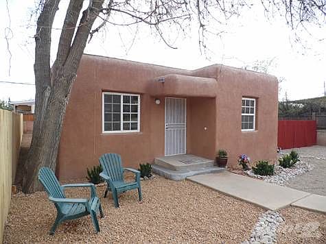 Large front yard is fully landscaped with low water use plants & creative, attractive 2nd parking sp
