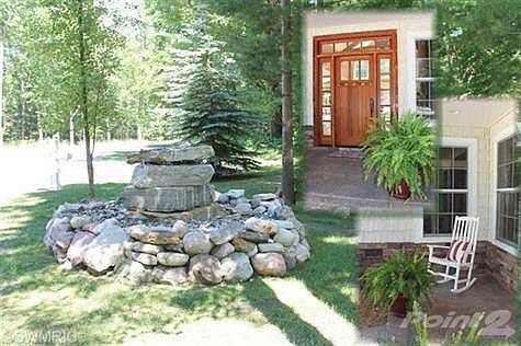 Beautiful front yard fountain lends to the relaxation and beauty of the woods. The gorgeous Fir fron