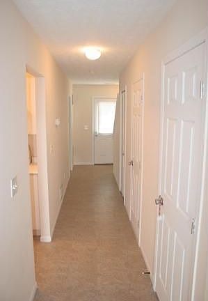 Hallway with storage, 1/2 Bath and Pantry